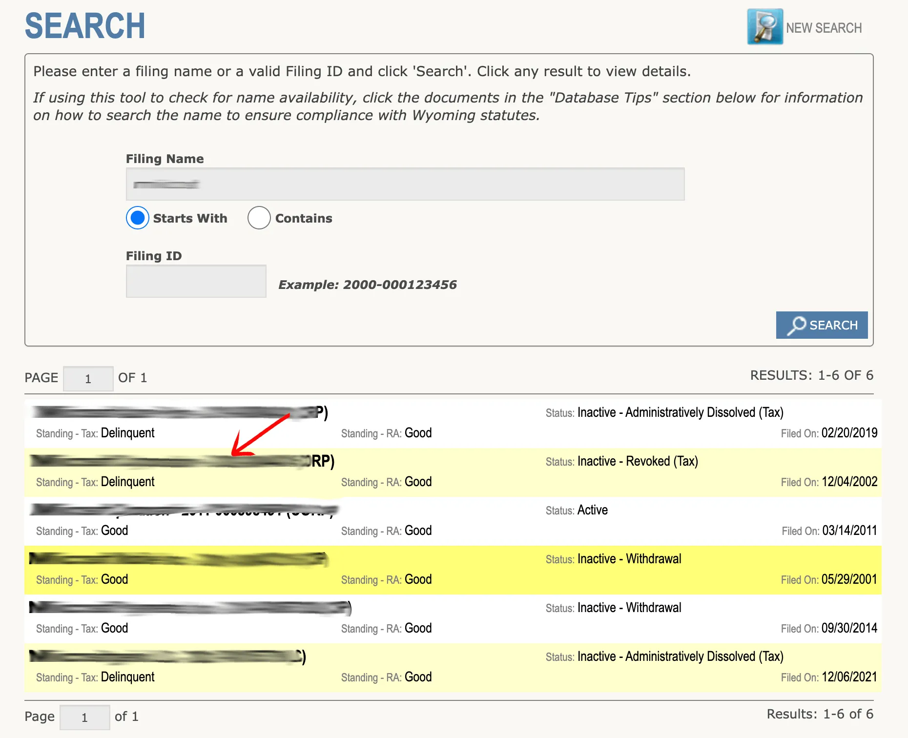 Wyoming WyoBiz search results showing entity rows with status, standing tax, standing registered agent, and filed-on dates
